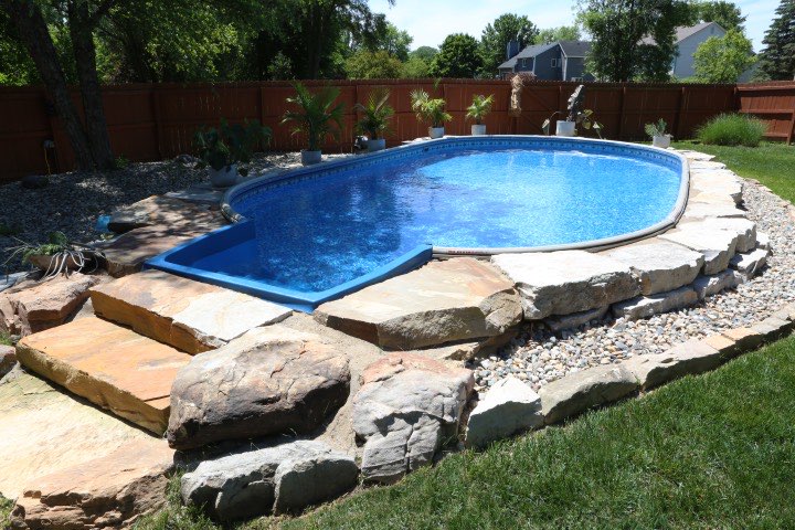 Hydrosphere Oval 15×30: semi-inground with boulders and stone steps