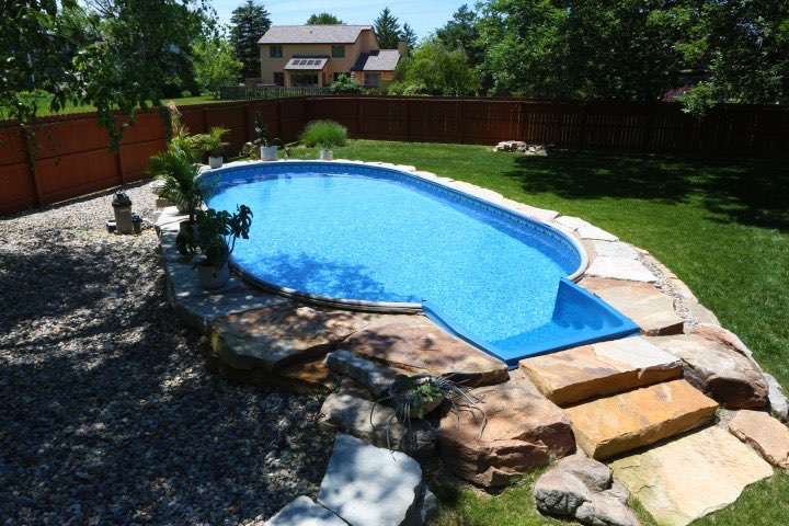 Hydrosphere Oval 15×30: semi-inground with boulders and stone steps