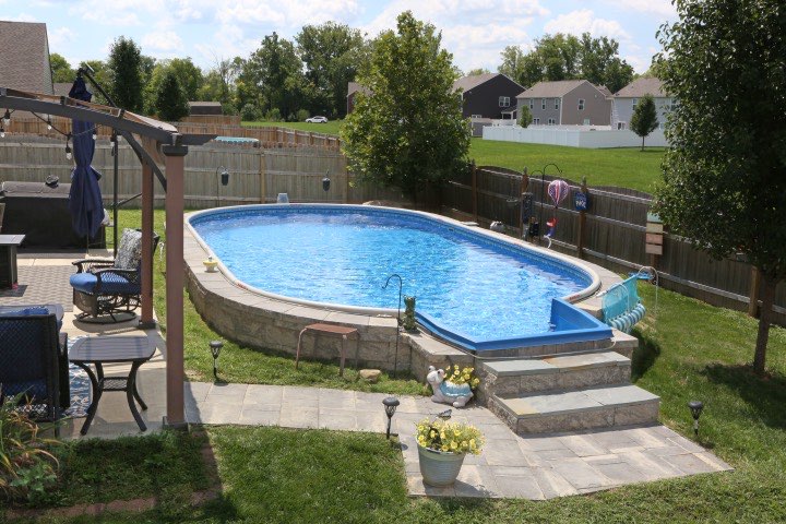 Hydrosphere Oval 15×30: semi-inground with stone veneer and steps
