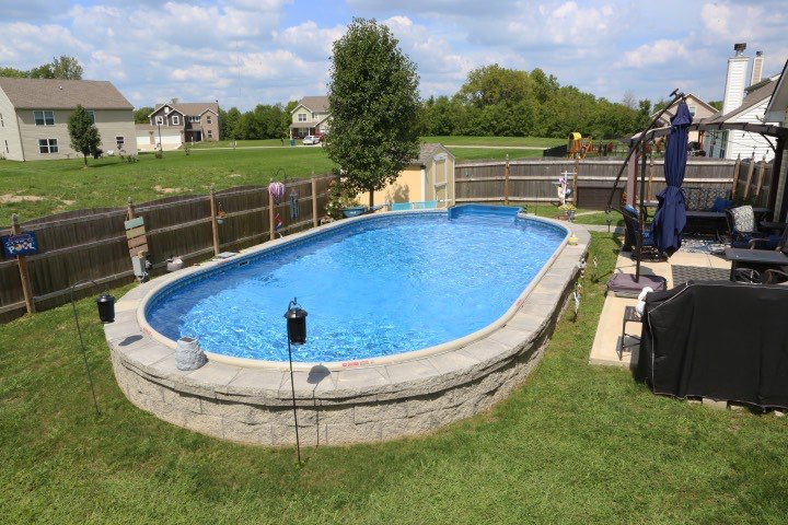 Hydrosphere Oval 15×30: semi-inground with stone veneer