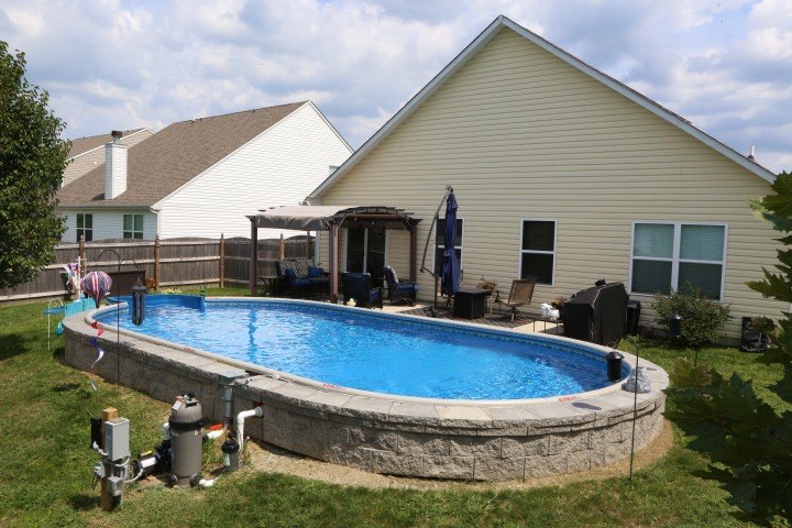 Hydrosphere Oval 15×30: semi-inground with stone veneer