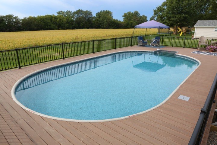 Hydrosphere Oval 18×33: semi-inground with a top rail and wood deck