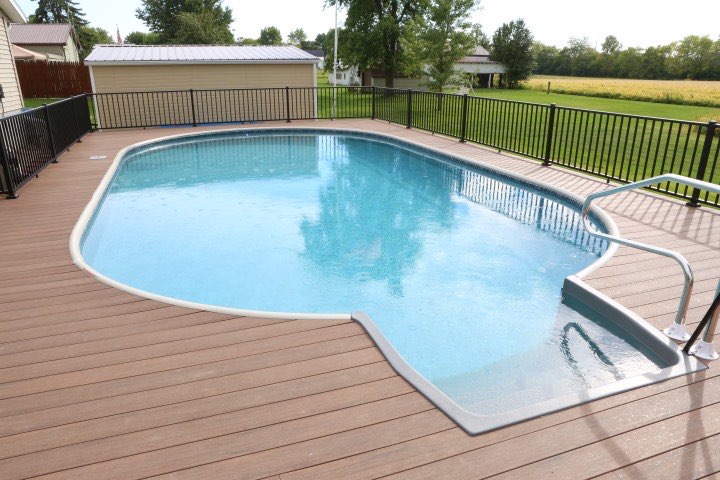 Hydrosphere Oval 18×33: semi-inground with a top rail and wood deck