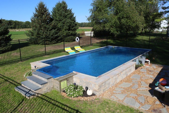 Hydrosphere Rectangle 6″ 14×28: semi-inground with stone veneer and steps