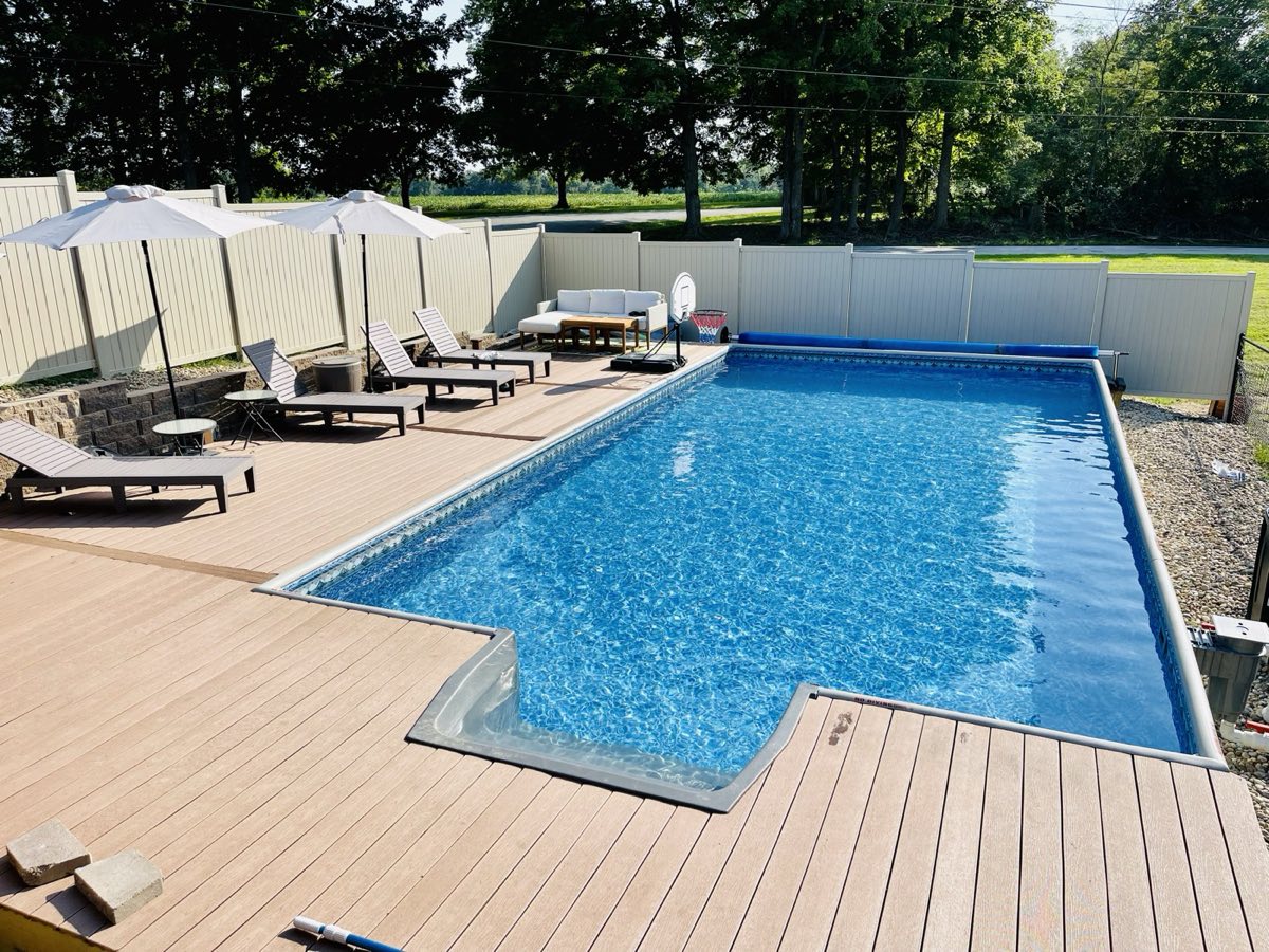 A Hydrosphere rectangle installed semi-inground with a composite deck